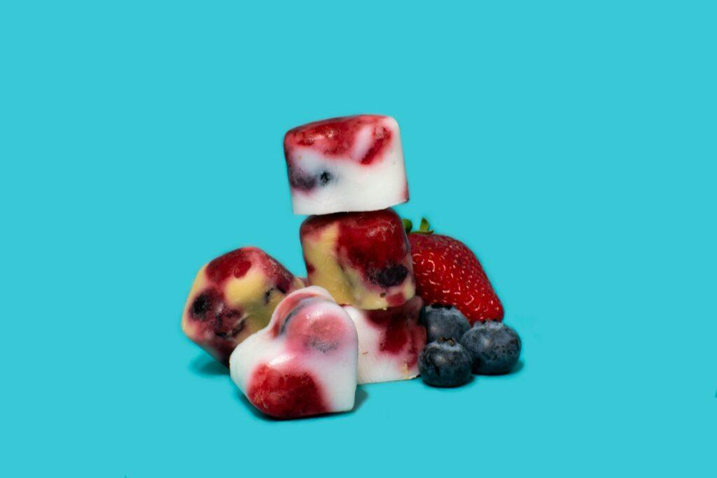 homemade frozen dog treats with yogurt, strawberries and blueberries